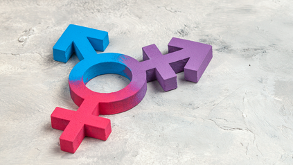 Gemeinsames Symbol für transgender, männlich und weiblich - vor grauem Hintergrund.